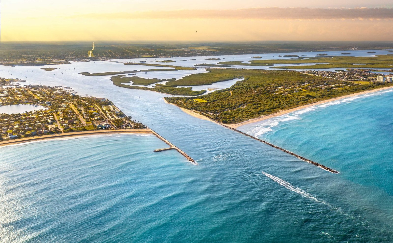 Golden-hour aerial of the Fort Pierce Inlet