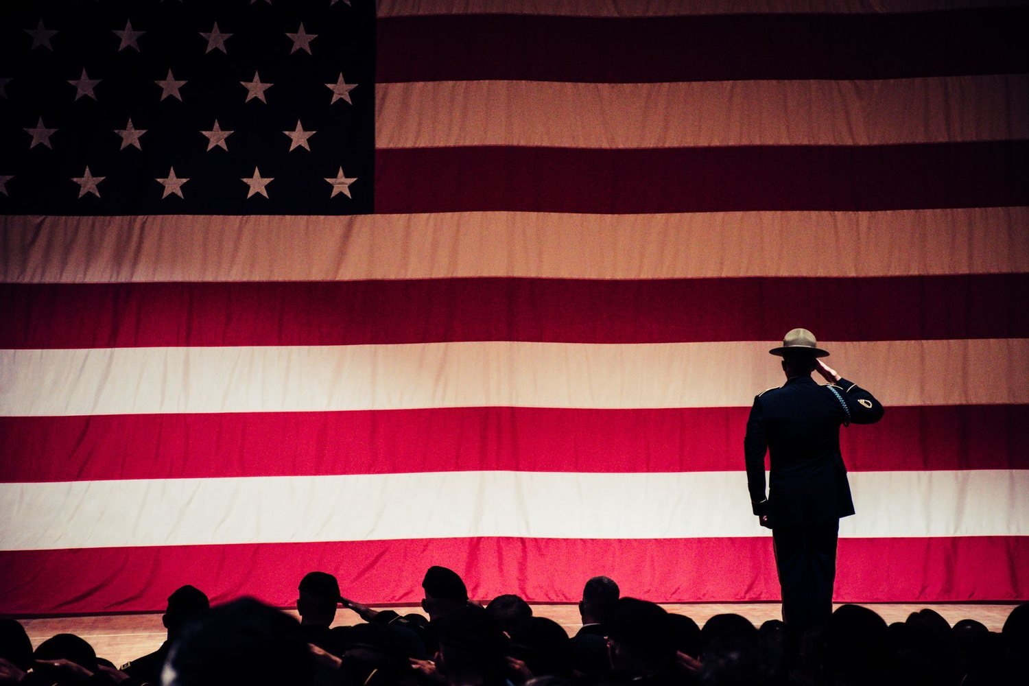 Soldier saluting the American flag